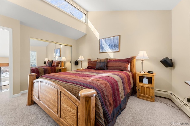 carpeted bedroom with a closet and vaulted ceiling