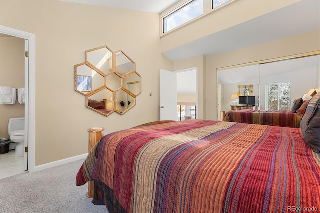 142 Eagle Dr Unit A3, Avon, CO 81620 - bedroom featuring carpet floors, baseboards, a towering ceiling, and ensuite bath