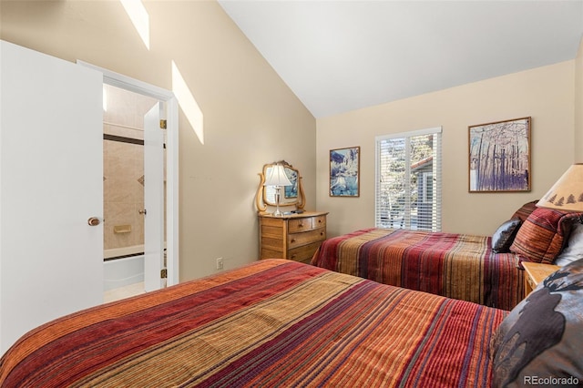 bedroom with vaulted ceiling and ensuite bathroom