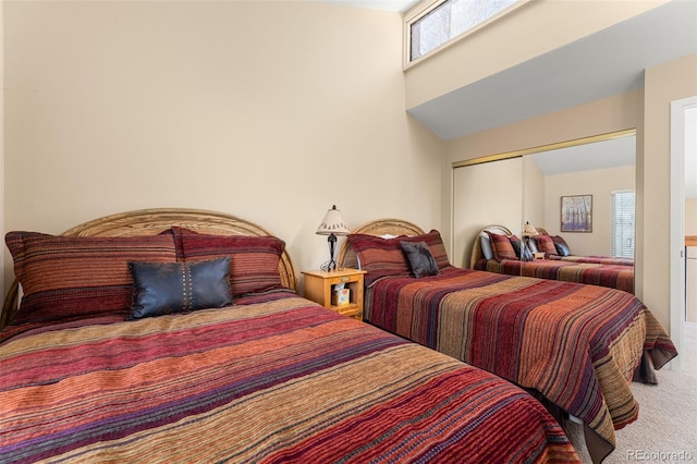 carpeted bedroom with a closet