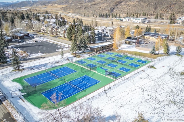 birds eye view of property with a mountain view