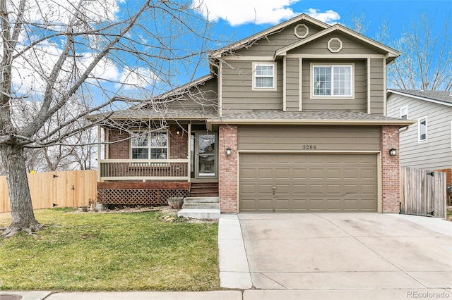 view of front of property with brick siding, concrete driveway, and fence