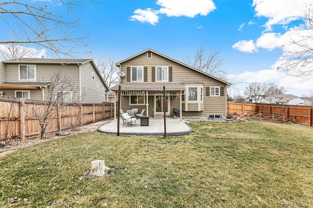 rear view of house with a fenced backyard, a lawn, and a patio