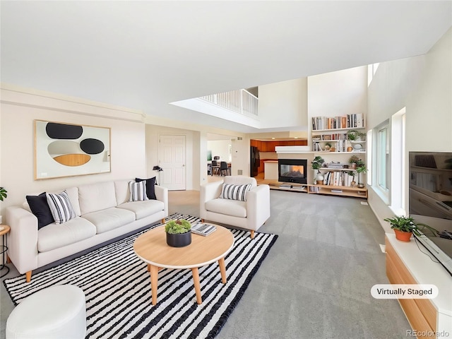 18951 E 43rd Ave, Denver, CO 80249 - living room with a high ceiling, carpet flooring, and a multi sided fireplace