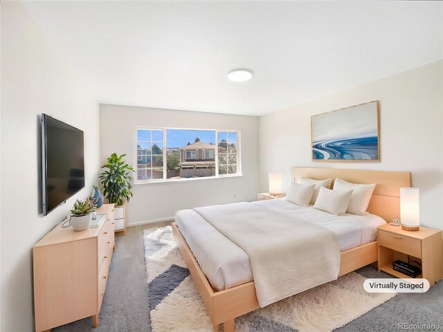 18951 E 43rd Ave, Denver, CO 80249 - carpeted bedroom featuring baseboards
