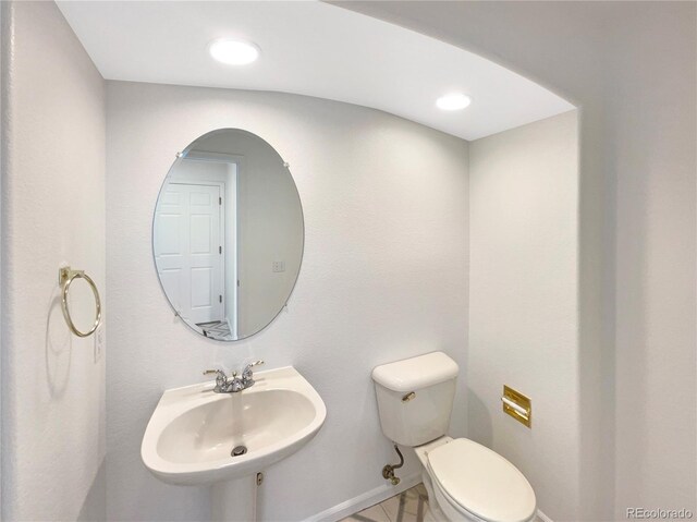 18951 E 43rd Ave, Denver, CO 80249 - bathroom featuring recessed lighting, toilet, and a sink