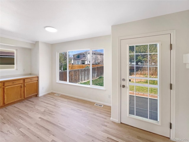 18951 E 43rd Ave, Denver, CO 80249 - interior space with light wood-type flooring, baseboards, and visible vents