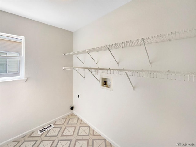 18951 E 43rd Ave, Denver, CO 80249 - laundry room with hookup for an electric dryer, baseboards, visible vents, washer hookup, and laundry area
