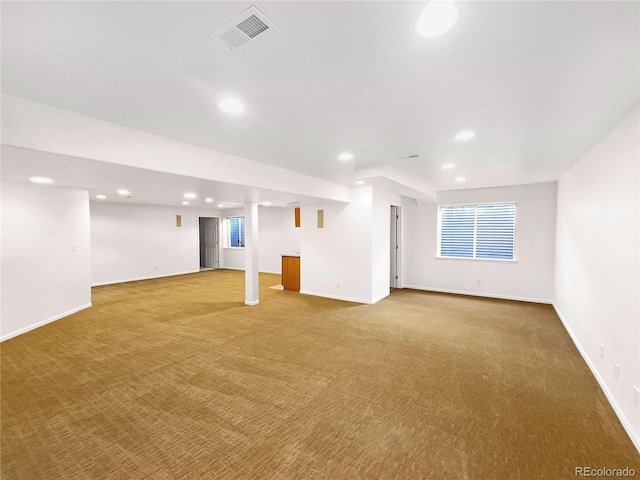 18951 E 43rd Ave, Denver, CO 80249 - basement featuring baseboards, light carpet, visible vents, and recessed lighting