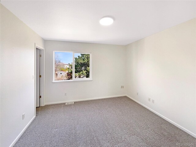 18951 E 43rd Ave, Denver, CO 80249 - carpeted spare room with baseboards and visible vents