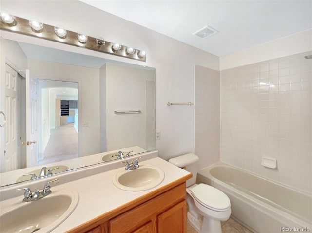 18951 E 43rd Ave, Denver, CO 80249 - bathroom featuring toilet, a sink, visible vents, and double vanity