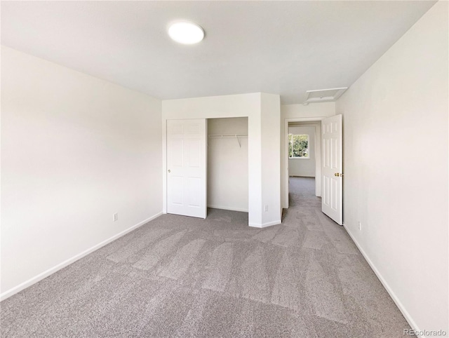 18951 E 43rd Ave, Denver, CO 80249 - unfurnished bedroom featuring attic access, carpet floors, a closet, and baseboards