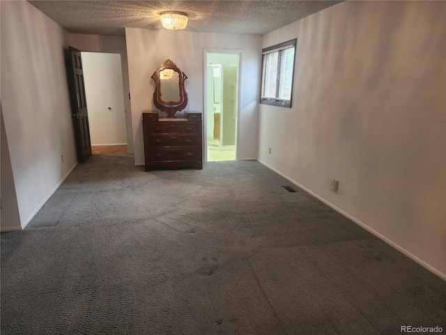 6961 E Arkansas Ave, Denver, CO 80224 - unfurnished room featuring a textured ceiling and carpet