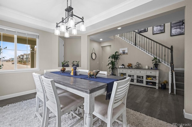 9021 Swan River St, Littleton, CO 80125 - dining space with stairs, wood finished floors, a chandelier, baseboards, and crown molding