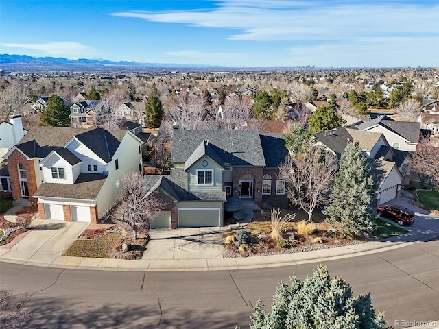 bird's eye view featuring a mountain view and a residential view