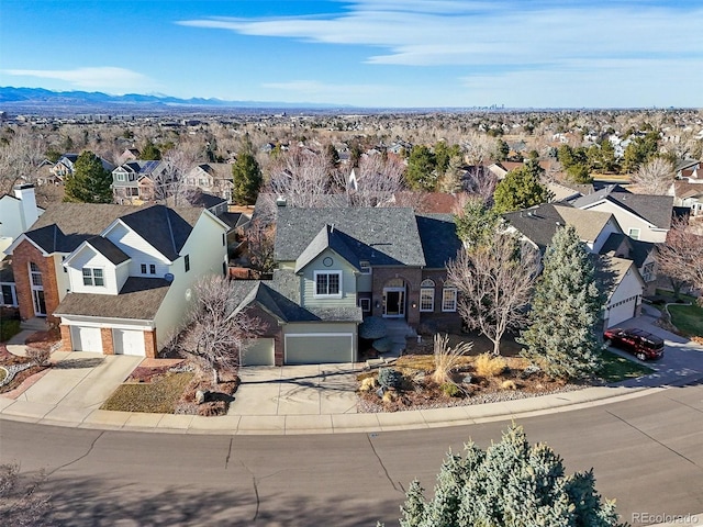 birds eye view of property featuring a residential view and a mountain view