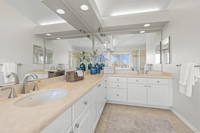 bathroom with a stall shower, vanity, tile patterned flooring, and recessed lighting