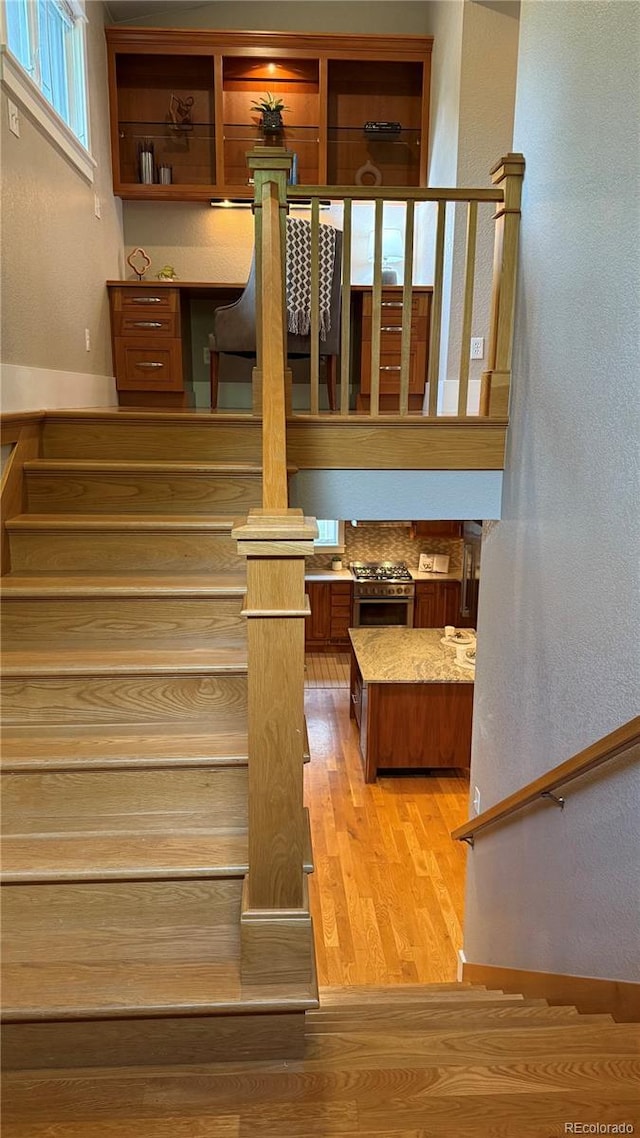 2692 N Raleigh St, Denver, CO 80212 - stairway featuring wood finished floors and a textured wall