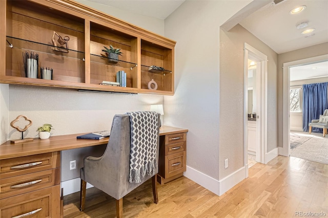 2692 N Raleigh St, Denver, CO 80212 - office space featuring built in study area, light wood-style flooring, and arched walkways