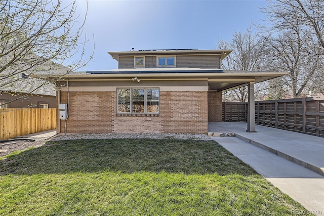 2692 N Raleigh St, Denver, CO 80212 - view of front of home featuring a fenced backyard, brick siding, and a patio