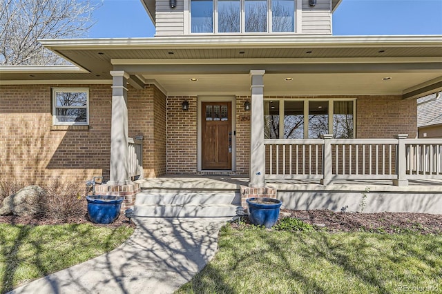 2692 N Raleigh St, Denver, CO 80212 - property entrance featuring a porch and brick siding