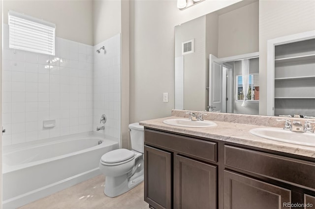 14301 E Tennessee Ave Unit 109, Aurora, CO 80012 - full bathroom featuring double vanity, shower / tub combination, toilet, and tile patterned flooring