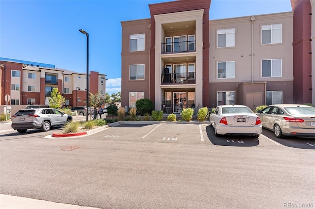 14301 E Tennessee Ave Unit 109, Aurora, CO 80012 - view of property featuring uncovered parking