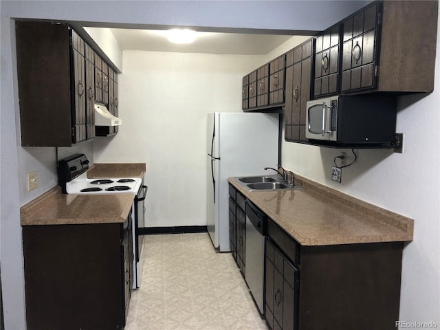 kitchen with appliances with stainless steel finishes, dark brown cabinetry, and sink