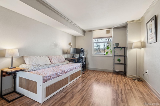 interior space with hardwood / wood-style floors and ornamental molding