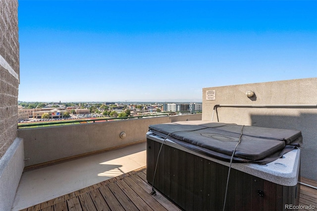 wooden deck with a hot tub