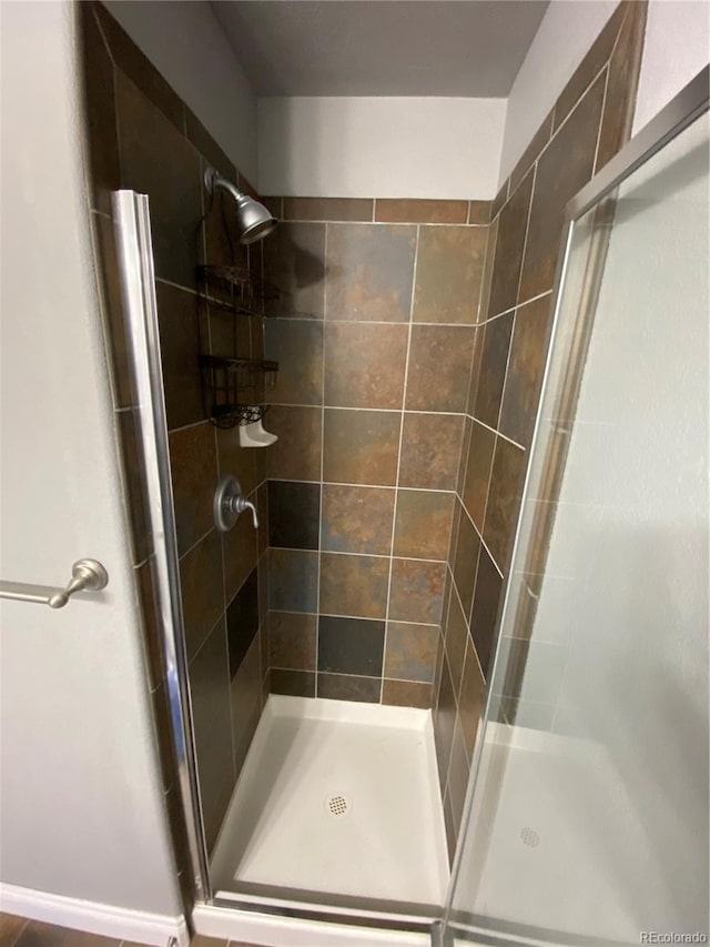 bathroom with an enclosed shower