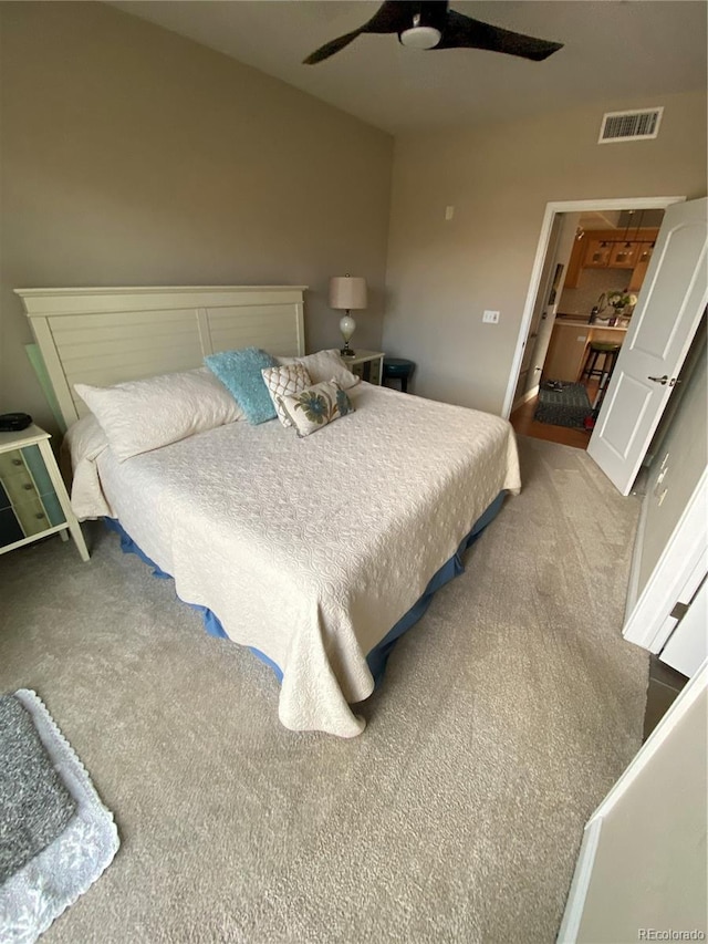 carpeted bedroom featuring ceiling fan