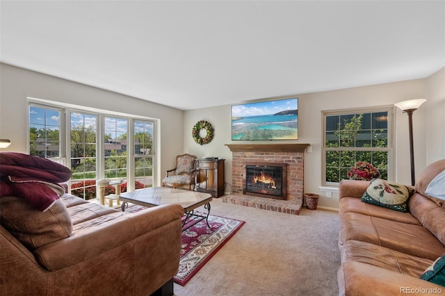 carpeted living area featuring a brick fireplace