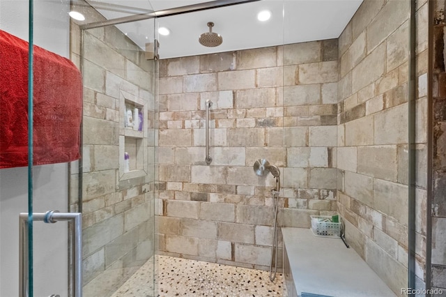 bathroom featuring a stall shower and recessed lighting