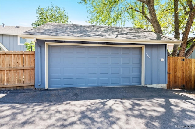 garage with fence