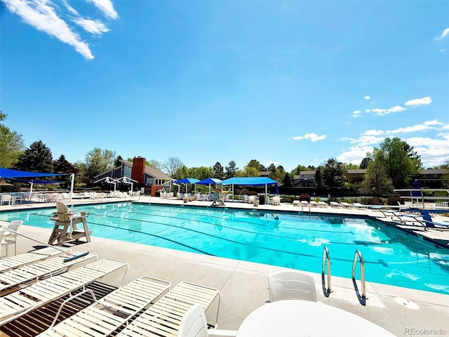 community pool with a patio area