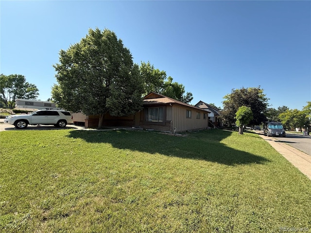 8995 E Cornell Ave, Denver, CO 80231 - view of side of home with a yard