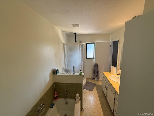8995 E Cornell Ave, Denver, CO 80231 - bathroom featuring a stall shower, vanity, and a bath