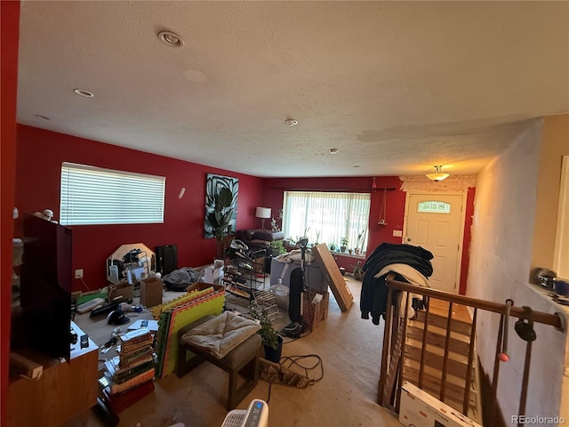 8995 E Cornell Ave, Denver, CO 80231 - living area with carpet floors and a textured ceiling