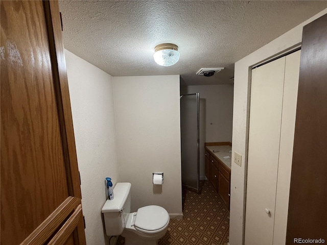 8995 E Cornell Ave, Denver, CO 80231 - full bathroom featuring a textured ceiling, a shower, tile patterned floors, and vanity