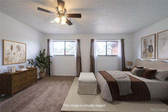 bedroom with ceiling fan, a textured ceiling, and carpet floors