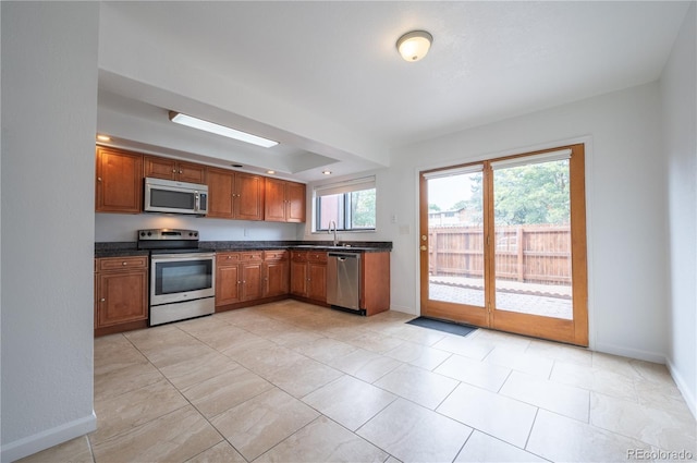 kitchen with sink and appliances with stainless steel finishes