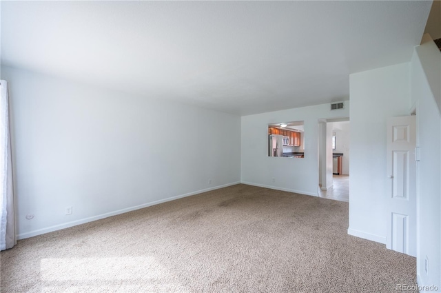 unfurnished room featuring carpet flooring