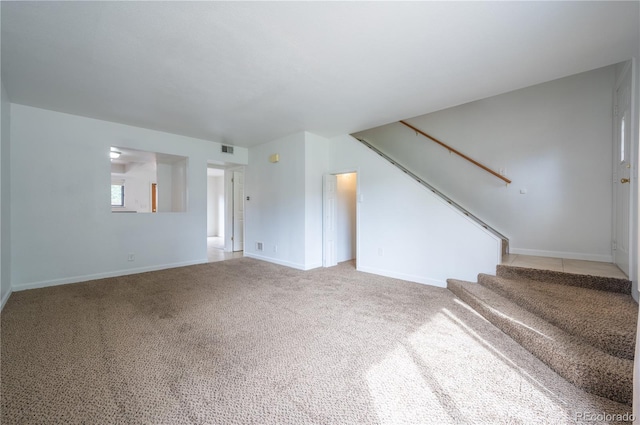 unfurnished living room with carpet flooring