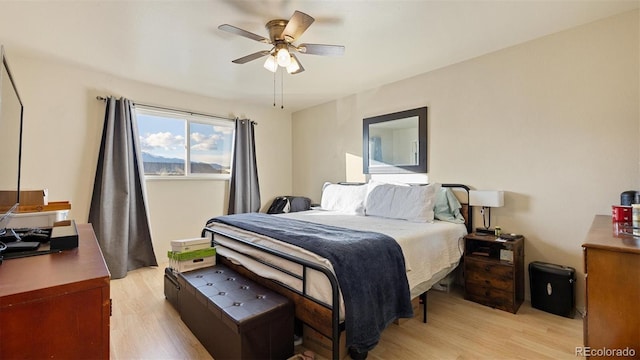 bedroom with ceiling fan and light hardwood / wood-style flooring