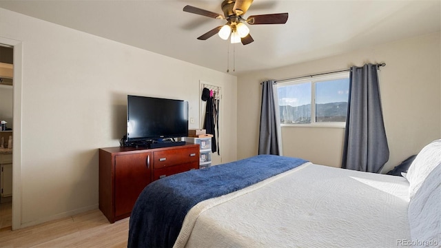 bedroom featuring light hardwood / wood-style flooring and ceiling fan