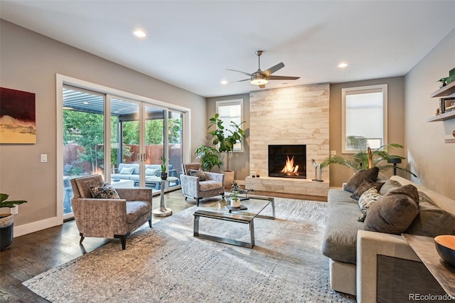 445 Forest St, Denver, CO 80220 - living room with a ceiling fan, recessed lighting, a stone fireplace, wood finished floors, and french doors