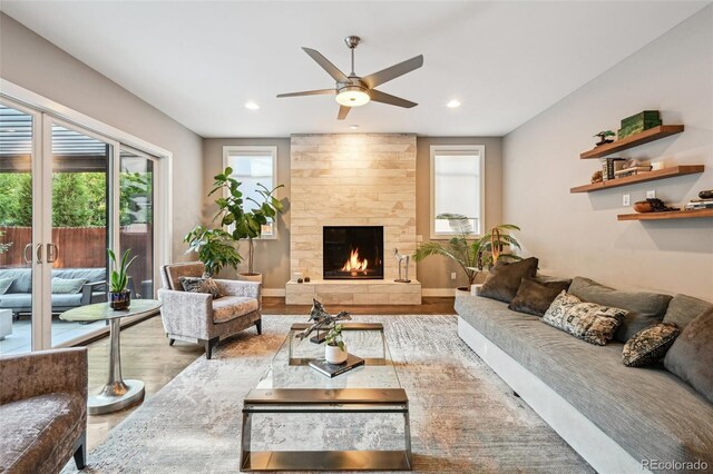 445 Forest St, Denver, CO 80220 - living room featuring wood finished floors, a ceiling fan, a large fireplace, and recessed lighting