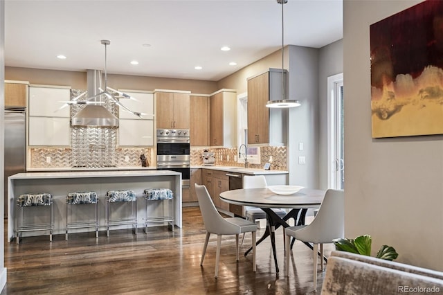 445 Forest St, Denver, CO 80220 - kitchen featuring double oven, light countertops, dark wood-type flooring, decorative backsplash, and recessed lighting