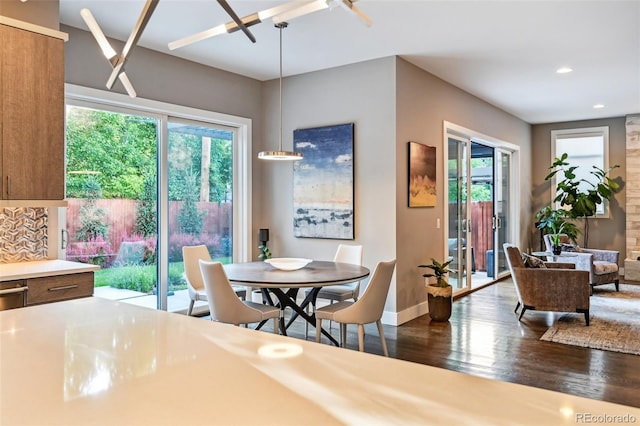 445 Forest St, Denver, CO 80220 - dining room featuring healthy amount of natural light, dark wood-style flooring, and recessed lighting